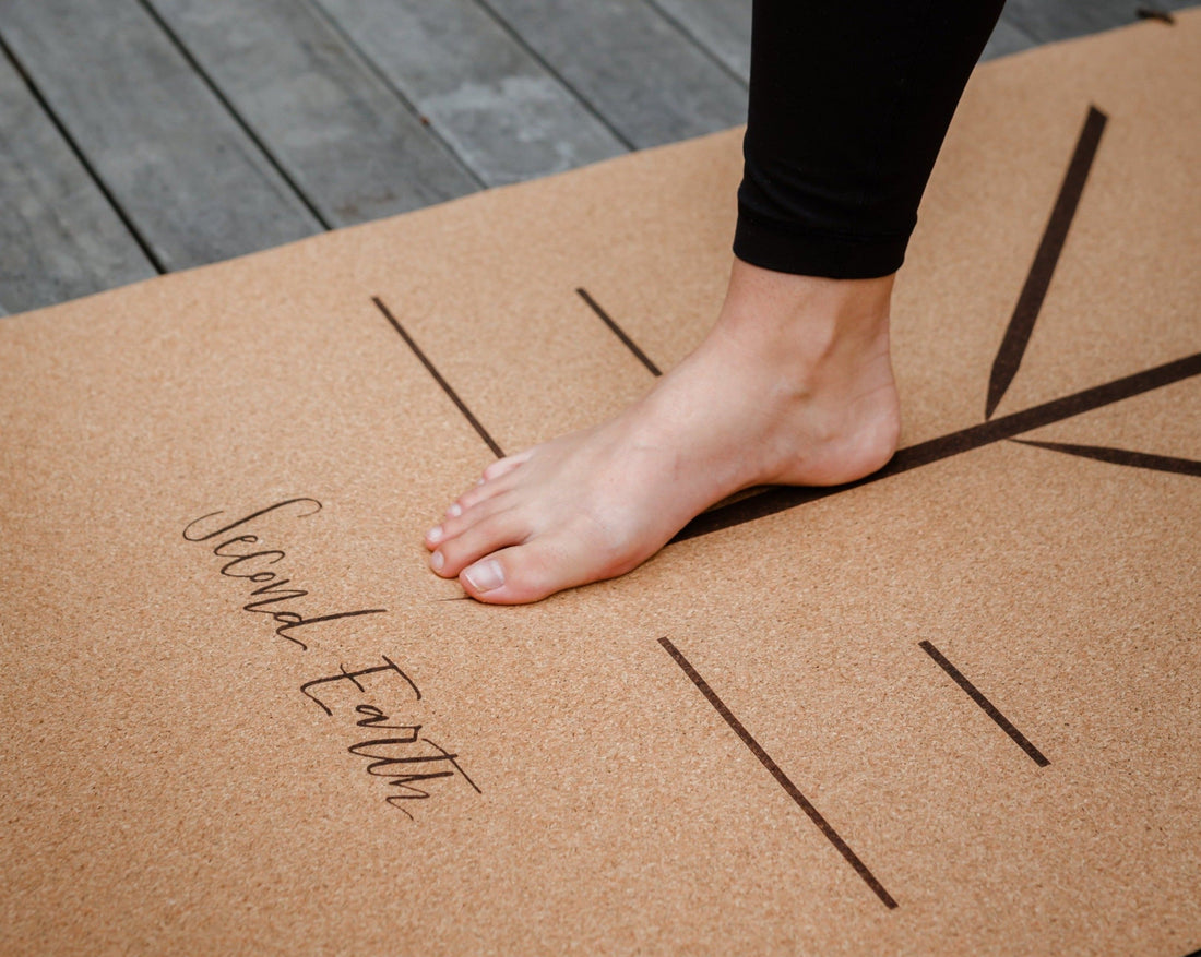 Yogi with foot on cork yoga mat