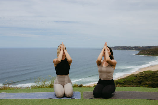 Yogis on cliff top 