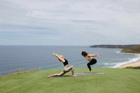 Yogis on mountain top practicing on Second Earth Yoga Mats