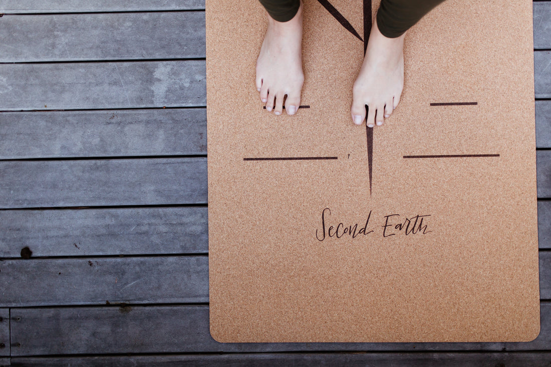Yogi standing barefoot on Second Earth Cork Yoga Mat