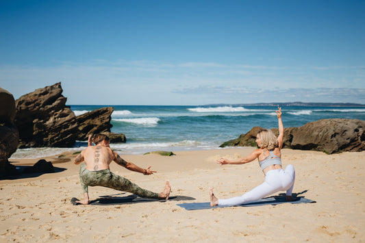 Yogis stretching on the beach