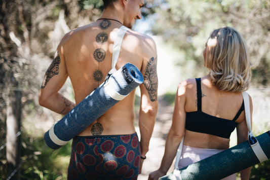 Yogis walking with Second Earth Eco Friendly Yoga Mats on their back
