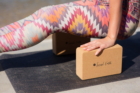 Yogi on Second Earth Yoga mat and cork block