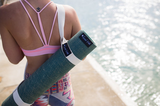 Yogi at the beach with Second Earth Yoga Mat
